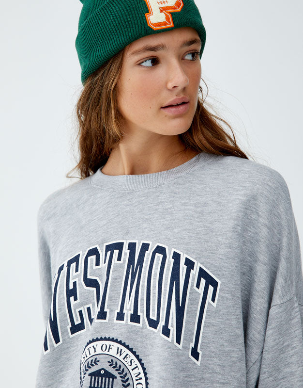 Sweatshirt with slogan on back