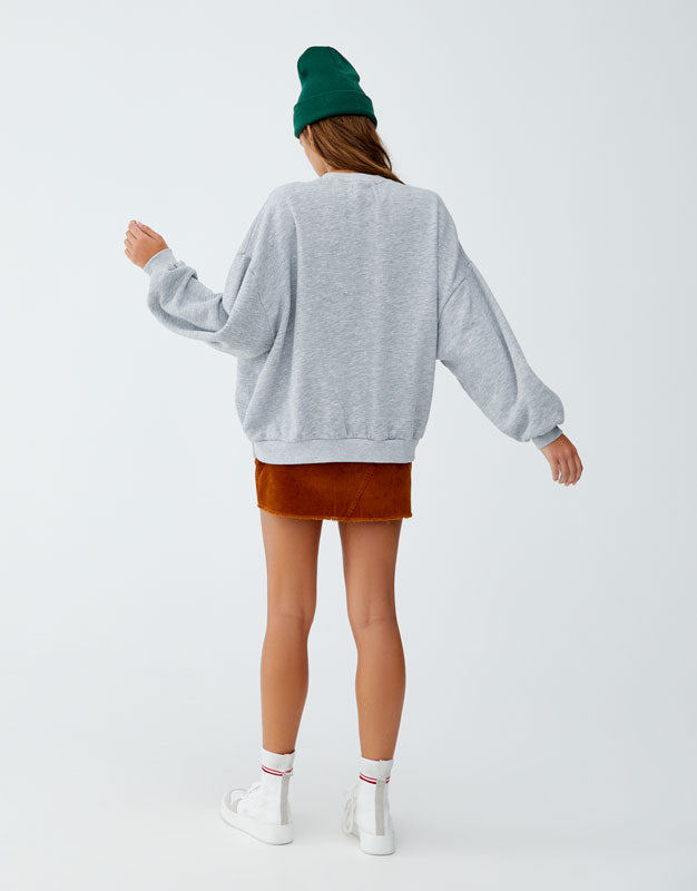 Sweatshirt with slogan on back