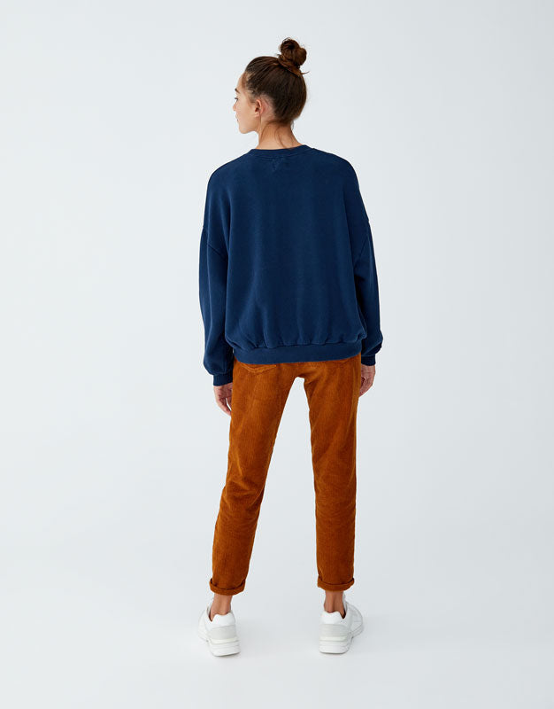 Sweatshirt with slogan on back